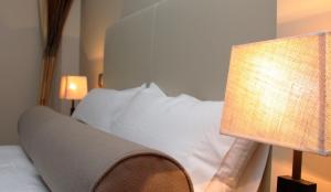 Кровать или кровати в номере Le Petit Boutique Hotel
