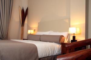 Кровать или кровати в номере Le Petit Boutique Hotel