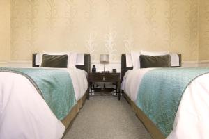 Postel nebo postele na pokoji v ubytování Hotel Casa Gangotena