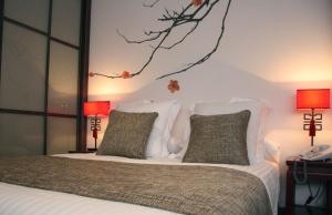 Кровать или кровати в номере Le Petit Boutique Hotel