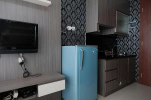 Televizorius ir (arba) pramogų centras apgyvendinimo įstaigoje RedLiving Apartemen Saladdin Mansion - RAN Management