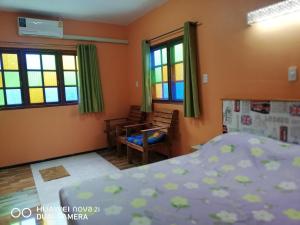 Ένα ή περισσότερα κρεβάτια σε δωμάτιο στο Bondoilampang