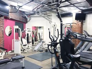 a gym with treadmills and exercise bikes in it at City Loft w/ View of Gay St in Knoxville