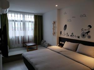 Postel nebo postele na pokoji v ubytování Chingya House