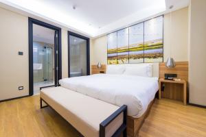Postel nebo postele na pokoji v ubytování Atour Hotel (Dongying Huanghe Road)