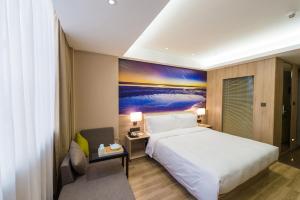 Postel nebo postele na pokoji v ubytování Atour Hotel (Dongying Huanghe Road)