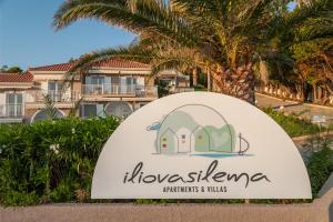 a sign at the entrance to horseshoe marriottriott villas at Iliovasilema in Platy