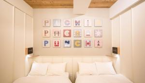 Letto o letti in una camera di Kamon Hotel Namba