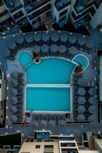 a view of a theatre with a blue wall at Porto Platanias Beach Luxury Selection - Adults Only in Plataniás