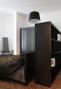 Łóżko lub łóżka w pokoju w obiekcie Valsabbion City Suite