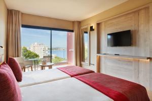 a hotel room with a bed and a large window at Bonanza Park Hotel by Olivia Hotels Collection in Illetas +86 photos
