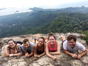 a group of people laying on top of a mountain at Pop-In Aonang in Ao Nang Beach