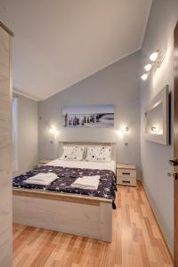 a bedroom with a large bed in a room at Fortress View apartment in Kotor