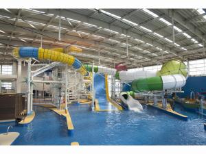 a large water park with a water slide at Spa World HOTEL&RESORT in Osaka