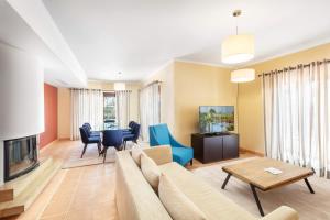 a living room with a couch and a table at Cascade Wellness Resort in Lagos