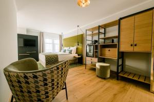 TV a/nebo společenská místnost v ubytování Weinhotel Freylich Zahn