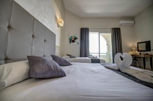 Letto o letti in una camera di Europa Hotel