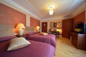 Posteľ alebo postele v izbe v ubytovaní Casablanca Pokoje i Apartamenty