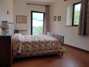 Ліжко або ліжка в номері Casa Lucia in Chianti