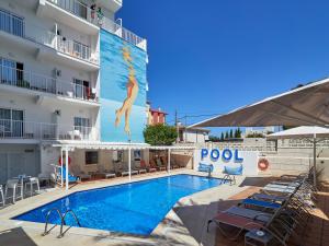 a swimming pool in front of a hotel at BQ Carmen Playa- Adults Only in Playa de Palma