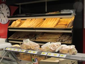 a display of bread and pastries on a shelf at Fisherman's cottage in Ile d'Arz