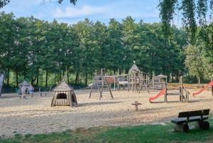 a playground with play equipment in a park at Ferienpark Grafschaft Bentheim in Uelsen
