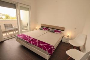 Giường trong phòng chung tại Villa Miggelangelo