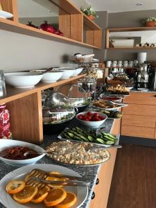 a buffet with many plates of food on a counter at Muyan Suites in Istanbul