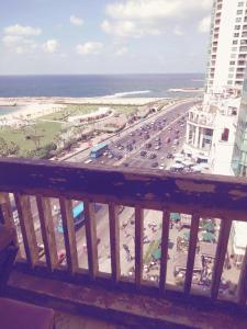 a view from a balcony of a parking lot at San Stefano apartment on the sea in Alexandria