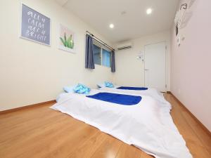 
セカンドハウスのようなプライベート宿 東京平和島 T Houseにあるベッド

