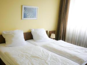 Postel nebo postele na pokoji v ubytování Hotel Oronto + 7 fotografií
