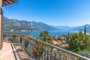 a balcony with a view of the water and mountains at Villa La Perla, Bellagio in Bellagio