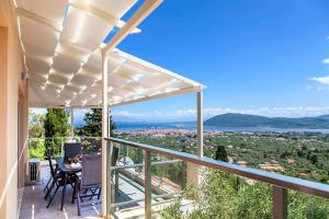 a view from the balcony of a house with a pergola at Villa Alba in Apolpaina +31 photos