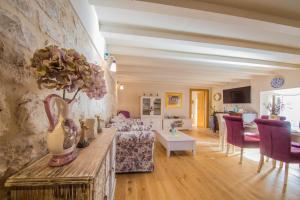 a living room with a couch and a table at Villa Martina in Komiža