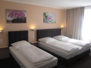 Postel nebo postele na pokoji v ubytování Milano Hotel