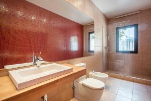 a bathroom with a white sink and a toilet at Boutique Villa Panorama in Tossa de Mar +29 photos