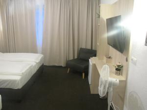 Postel nebo postele na pokoji v ubytování Milano Hotel