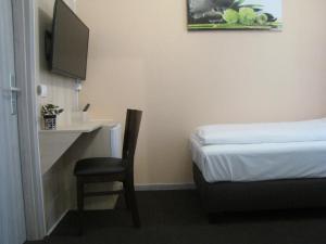 TV a/nebo společenská místnost v ubytování Milano Hotel