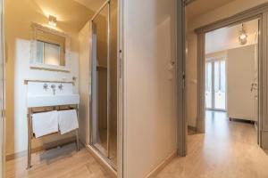 a bathroom with a sink and a mirror at Nina Casetta De Trastevere in Rome