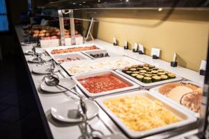 a buffet line with many different types of food at Ona Alanda Club Marbella in Marbella