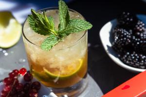 a drink with a lime and a mint leaf on top at Ona Alanda Club Marbella in Marbella