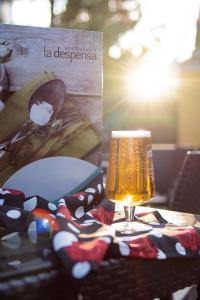 a table with a glass of beer on top of it at Ona Alanda Club Marbella in Marbella