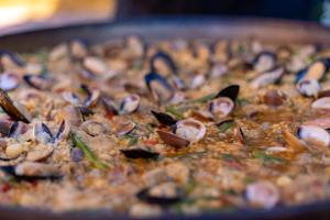 a close up of a pizza with mushrooms on it at Ona Alanda Club Marbella in Marbella