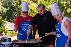 three people wearing chefs hats cooking on a grill at Ona Alanda Club Marbella in Marbella