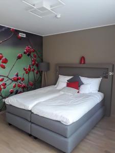 Una cama o camas en una habitación de Péitche Lauer