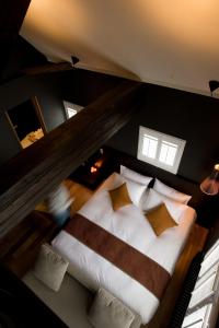 Una cama o camas en una habitación de Kimamaya By Odin