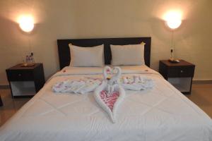 Postel nebo postele na pokoji v ubytování D'Batur Hotel