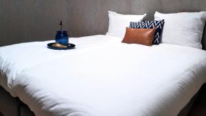 Una cama o camas en una habitación de Péitche Lauer
