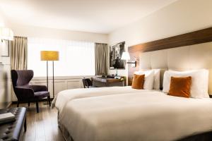 Postel nebo postele na pokoji v ubytování Hotel Astoria