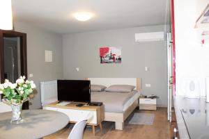 Posteľ alebo postele v izbe v ubytovaní Apartmani Žužić